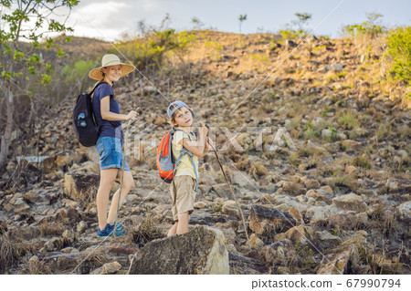 A family of local tourists goes on a local hike during quarantine COVID 19 A family of local tourists goes on a local hike during quarantine COVID 19 67990794