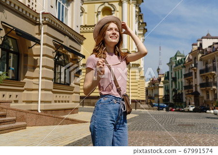 Beautiful Young Woman tourist Pleasant walk in the City Center Beautiful Young Woman tourist Pleasant walk in the City Center 67991574