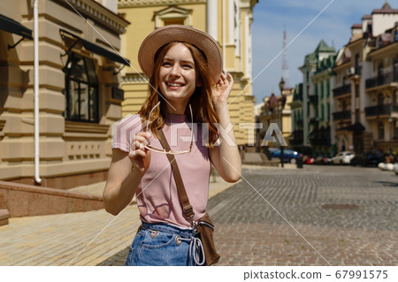 Beautiful Young Woman tourist Pleasant walk in the City Center Beautiful Young Woman tourist Pleasant walk in the City Center 67991575