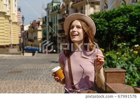 Beautiful Young Woman tourist Pleasant walk in the City Center 67991576
