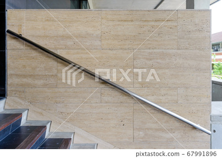 Modern stainless steel railing outside building. Modern stainless steel railing outside building. 67991896