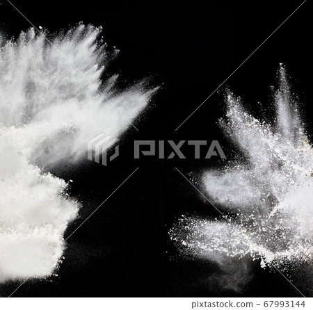 cloud of white wheat flour on a black background, 67993144