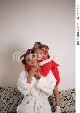 Emotions. Happy loving family. Mother and daughter spend time together at home. Emotions. Happy loving family. Mother and daughter spend time together at home. 67993340
