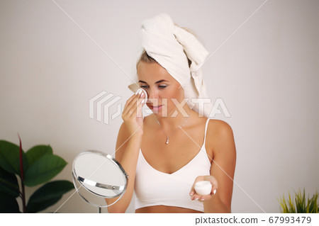 beauty and spa. Facial treatment. Cosmetology girl with clean fresh skin touching her own face 67993479