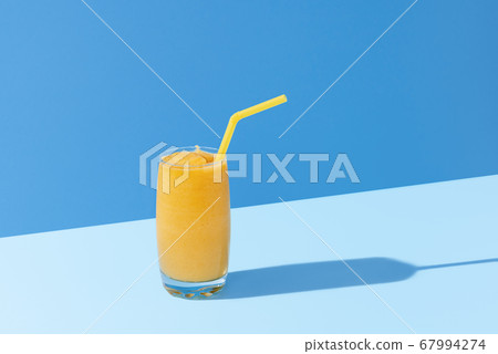 Mango smoothie on blue color. Summer drink. Mango Mango smoothie on blue color. Summer drink. Mango 67994274