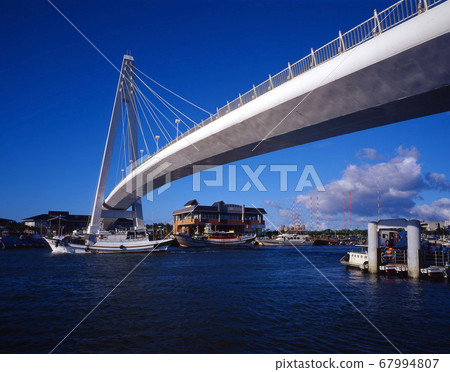 Boats and bridges at the port terminal 67994807