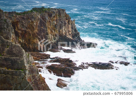 Waves hitting a cliff Waves hitting a cliff 67995806
