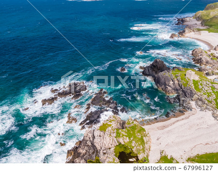 Aerial view of the beautiful coast next to Carrickabraghy Castle - Isle of Doagh, Inishowen, County Donegal - Ireland Aerial view of the beautiful coast next to Carrickabraghy Castle - Isle of Doagh, Inishowen, County Donegal - Ireland 67996127