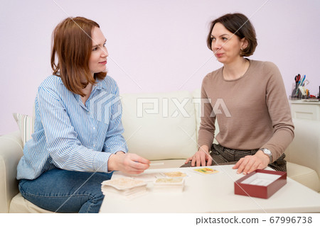 woman in the psychologist office Association cards 67996738