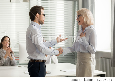 Executive shaking hand of mature businesswoman, promotion, introduction Executive shaking hand of mature businesswoman, promotion, introduction 67996985