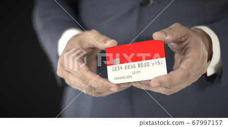 Businessman holding plastic bank card with printed flag of Indonesia, fictional numbers Businessman holding plastic bank card with printed flag of Indonesia, fictional numbers 67997157