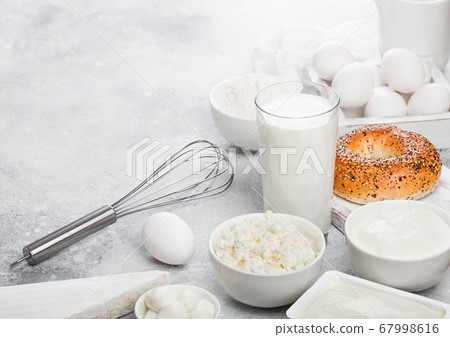 Fresh dairy products on white table background. 67998616