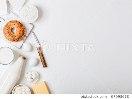 Fresh dairy products on white table background. 67998618