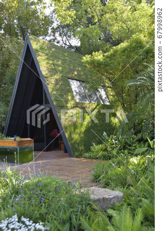 Eco-friendly wooden houses with green buildings 67998962