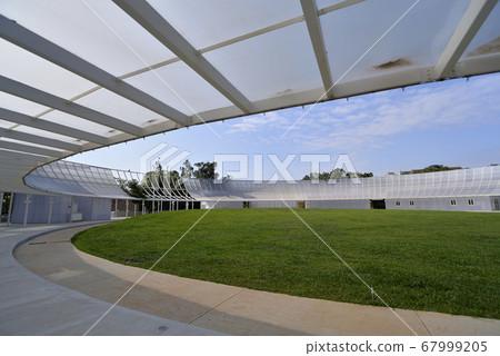 Sports ground lawn and light-transmitting glass buildings 67999205
