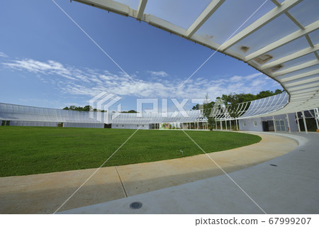 Sports ground lawn and light-transmitting glass buildings Sports ground lawn and light-transmitting glass buildings 67999207