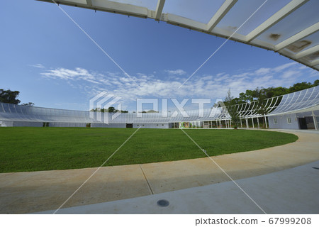 Sports ground lawn and light-transmitting glass buildings Sports ground lawn and light-transmitting glass buildings 67999208