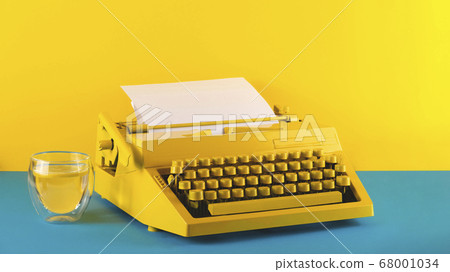 Yellow bright typewriter on a yellow background. Creativity concept 68001034