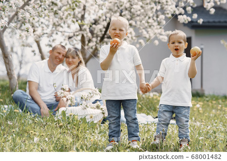 Cute family playing in a summer yard Cute family playing in a summer yard 68001482