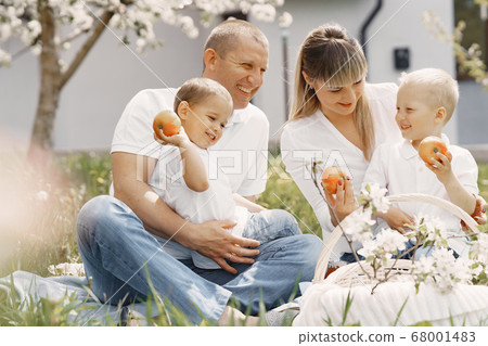 Cute family playing in a summer yard Cute family playing in a summer yard 68001483
