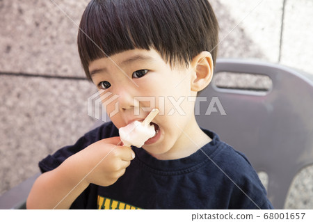 child eating ice cream child eating ice cream 68001657