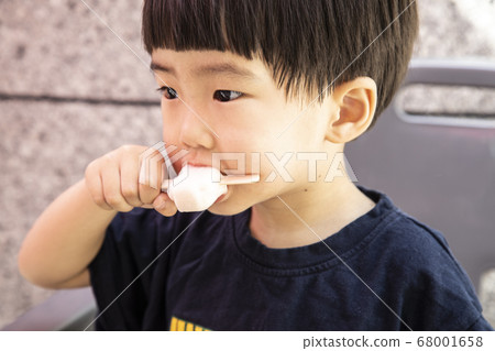 child eating ice cream child eating ice cream 68001658