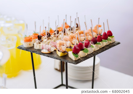 Different light snack appetizer on tray at the Different light snack appetizer on tray at the 68002045