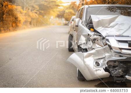 Autumn road front of light gray color car with Autumn road front of light gray color car with 68003733