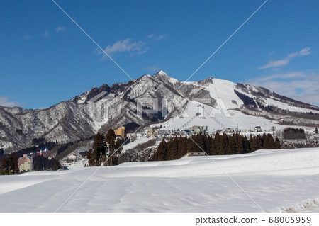 Clear snow fields and Mt. Ishiyama, Yuzawa Town, Niigata Prefecture 68005959