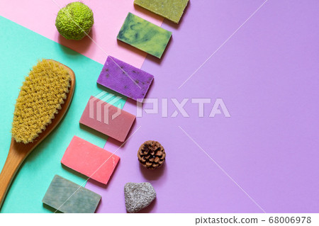 Multi-colored handmade soap made from natural ingredients on a colored background. the layout of the space 68006978