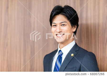 Male lawyer standing in court 68007266