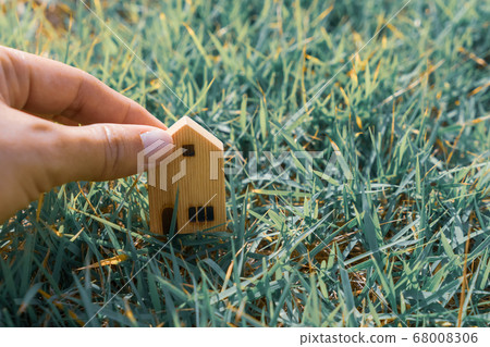 Closed up tiny home model on green grass with 68008306