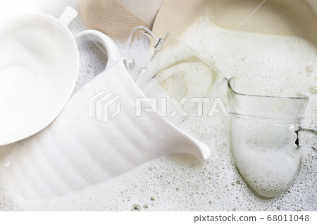 Washing dishes, Close up of utensils soaking Washing dishes, Close up of utensils soaking 68011048