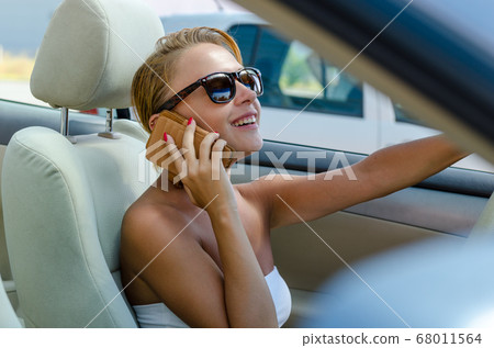 Woman driving a car Woman driving a car 68011564