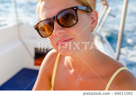 Red woman on a yacht cruise 68011565