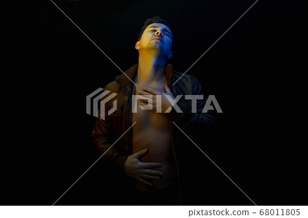 young Man. sexy Handsome Boy in color lights 68011805