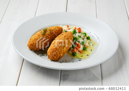 Cutlet stuffed with cheese served with rice, green 68012411