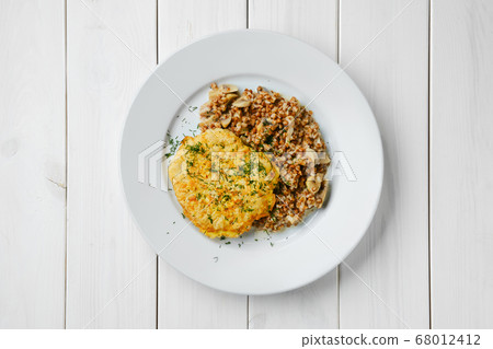 Top view of chicken cutlet with buckwheat and 68012412