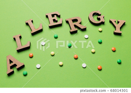 the word allergy is laid out on a green background the word allergy is laid out on a green background 68014301