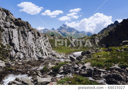 Mountain path to the blue lake of chianale, in the italian alps Mountain path to the blue lake of chianale, in the italian alps 68015027