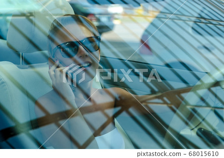 Woman driving a car 68015610