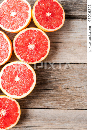 Fresh grapefruits on wooden background 68016201