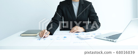 businesswomen bookkeeper use calculator and laptop doing account for paying tax on white desk in working office 68016839