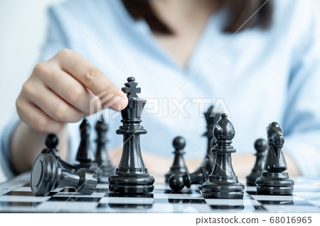 hand move chess with strategy and tactic to win enemy, play battle on board game, business opportunity competition strategic challenge concept hand move chess with strategy and tactic to win enemy, play battle on board game, business opportunity competition strategic challenge concept 68016965