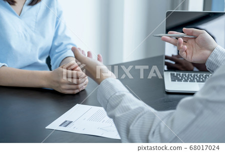 Business office executives are interviewing job applicants in the meeting room Business office executives are interviewing job applicants in the meeting room 68017024