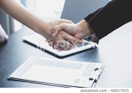 hands shake after business office executives are interviewing job applicants in the meeting room hands shake after business office executives are interviewing job applicants in the meeting room 68017025