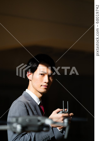 Drone business suit office male 1 man small number in-flight business negotiations maneuvering morning bright Drone business suit office male 1 man small number in-flight business negotiations maneuvering morning bright 68019742