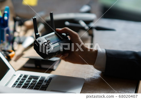 Drone business suit office man one man small group desk business discussion morning bright window Drone business suit office man one man small group desk business discussion morning bright window 68020407