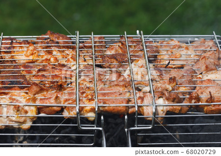 grill barbecue meat on a brazier with smoke, green grill barbecue meat on a brazier with smoke, green 68020729