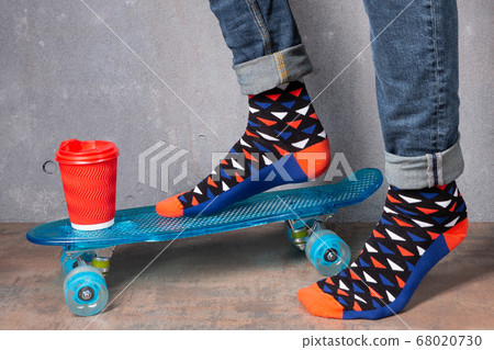 men's legs in colored socks, on a blue skateboard, men's legs in colored socks, on a blue skateboard, 68020730